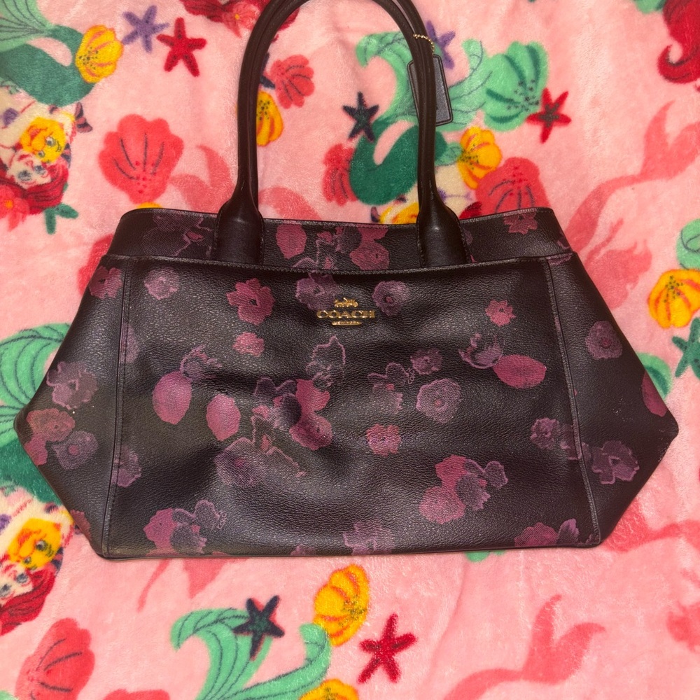 Black coach purse with pink and purple flowers